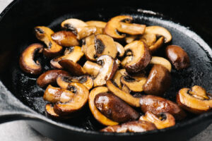 Sautéed mushrooms in a cast iron skillet.