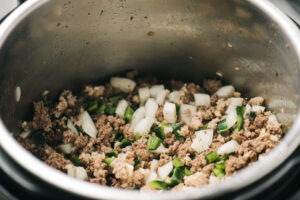 Sauteed ground beef, ground pork, onion, poblano pepper, and jalapeno in an instant pot.