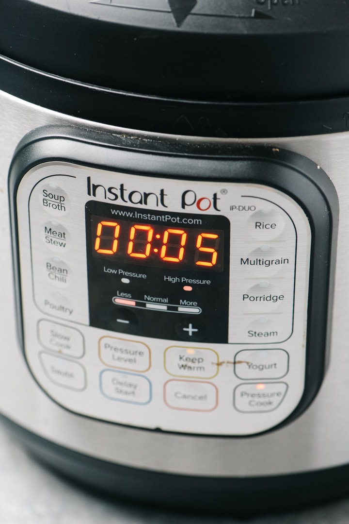 An instant pot programmed to 5 minutes high pressure.