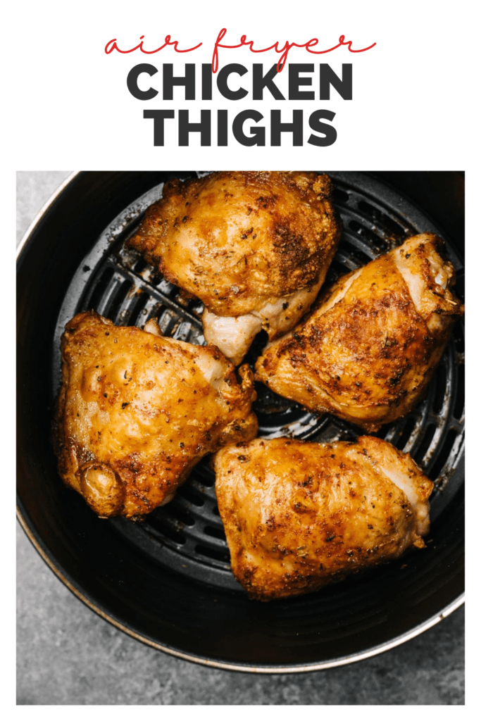 Crispy chicken thighs in the basket of an air fryer with a title bar that reads "air fryer chicken thighs"