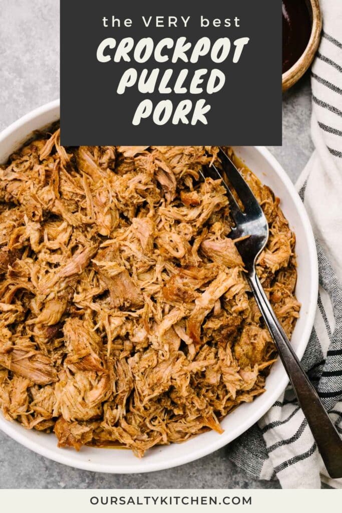 A serving fork tucked into a large white bowl of crockpot pulled pork; a bowl of barbecue sauce and striped linen napkin surround the bowl; title bar at the top reads "the very best crockpot pulled pork".