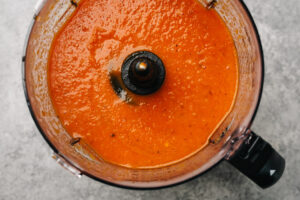 Roasted red pepper soup in a blender, pureed until smooth.