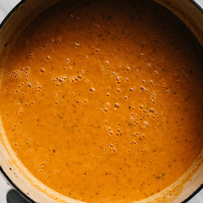 Pureed roasted tomato soup in a dutch oven.