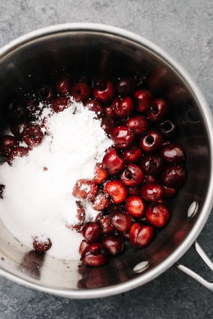 Pitted cherries, sugar, cornstarch, and lemon juice in a sauc epot.