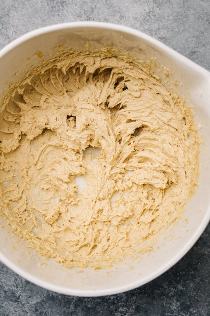 Butter and brown sugar creamed in a mixing bowl.