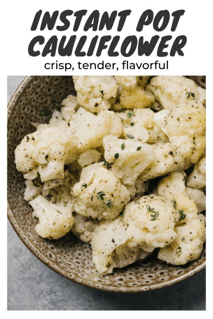 Steamed instant pot cauliflower tossed with olive oil and fresh herbs in a brown speckled bowl on a concrete background with a title bar at the top that reads "instant pot cauliflower - crisp, tender, flavorful".