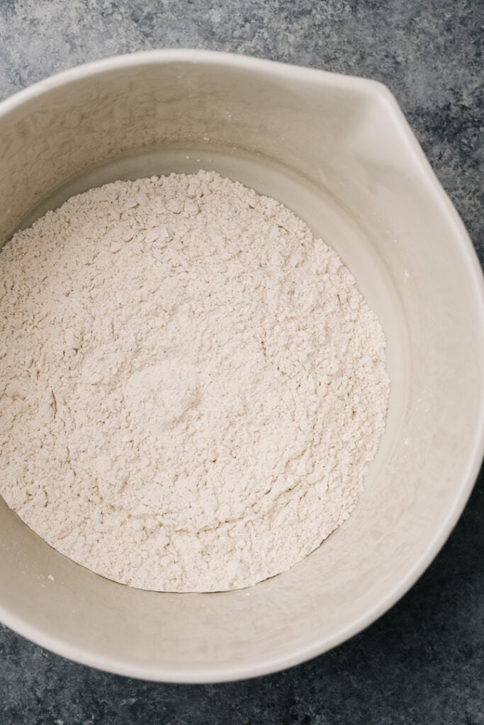Flour, sugar, salt, and baking powder whisked in a large mixing bowl.