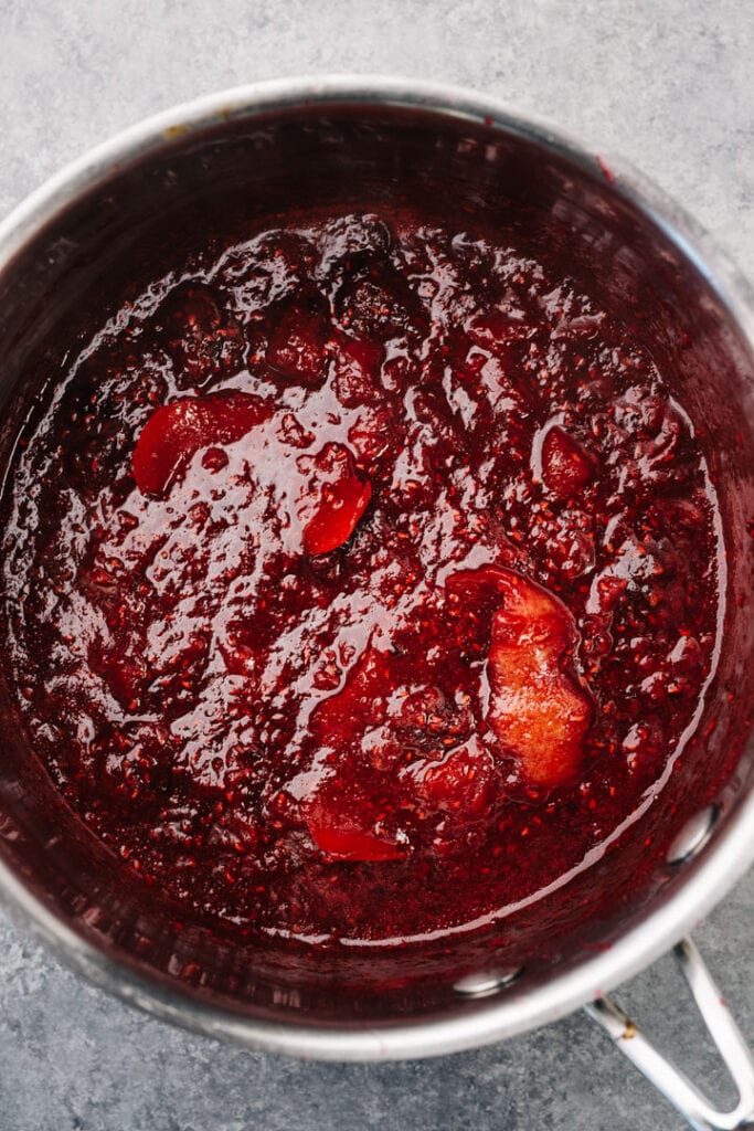 Thickened berry compote in saucepot.