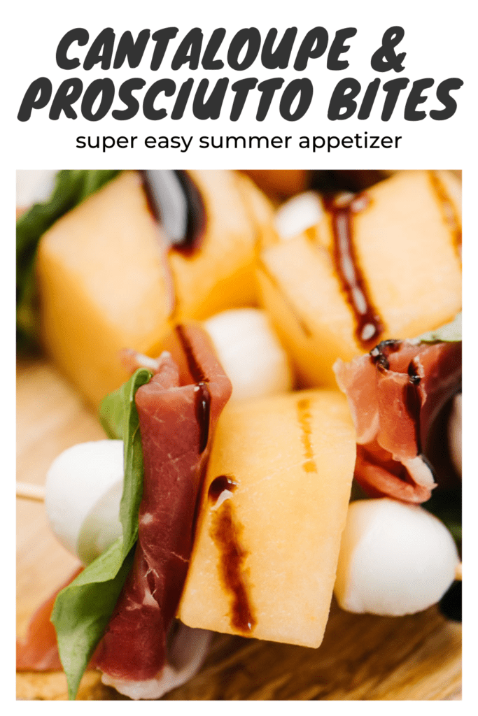 Side view, cantaloupe and prosciutto appetizer bites on a wood platter, drizzled with balsamic glaze.