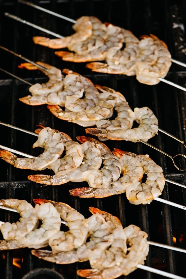 Skewered shrimp on a gas grill.