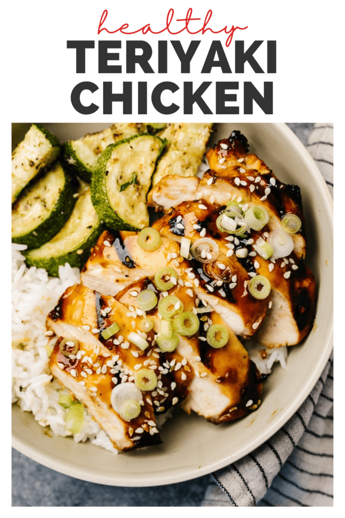 Slices of grilled teriyaki chicken over white rice and sautéed zucchini, garnished with green onions and sesame seeds with a title bar that reads "healthy teriyaki chicken"