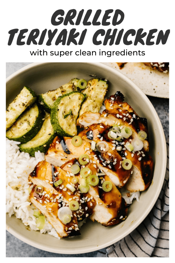 Slices of grilled teriyaki chicken over white rice and sautéed zucchini, garnished with green onions and sesame seeds with a title bar that reads "grilled teriyaki chicken with super clean ingredients".