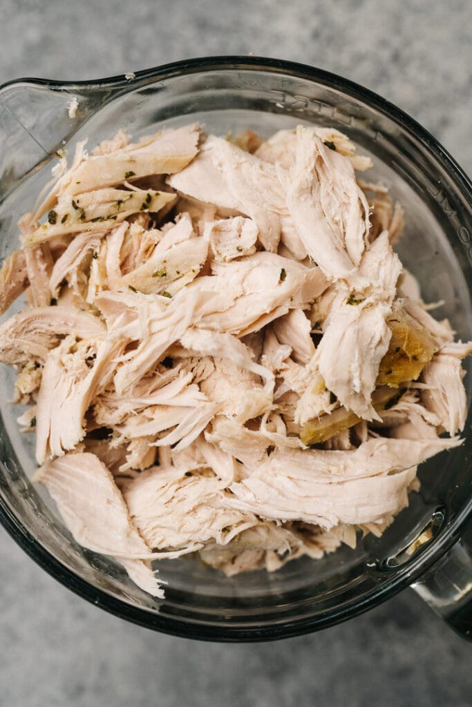 Shredded turkey in a 4 cup glass mixing bowl.