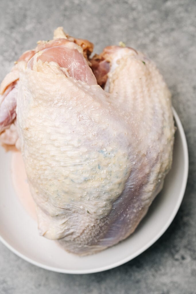 A turkey breast with garlic herb butter rubbed under the skin.