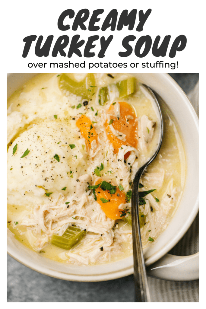 Pinterest image for creamy leftover turkey soup, served over mashed potatoes.
