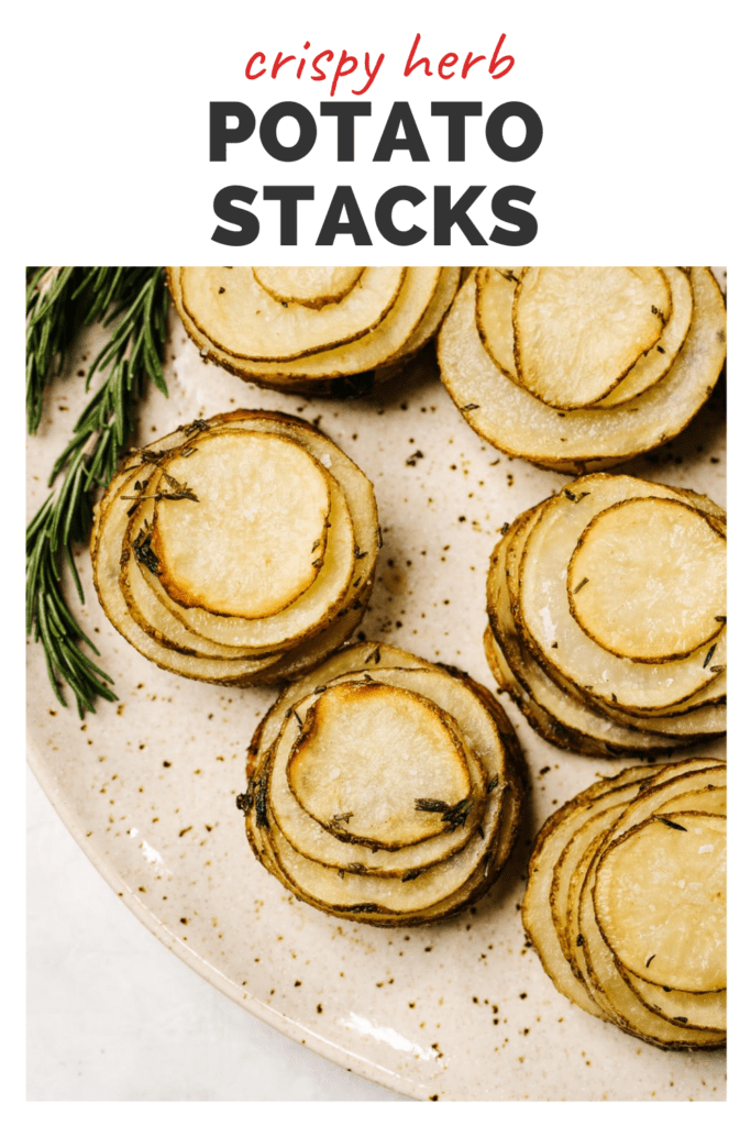 Pinterest image for crispy potato stacks made with butter and fresh herbs.