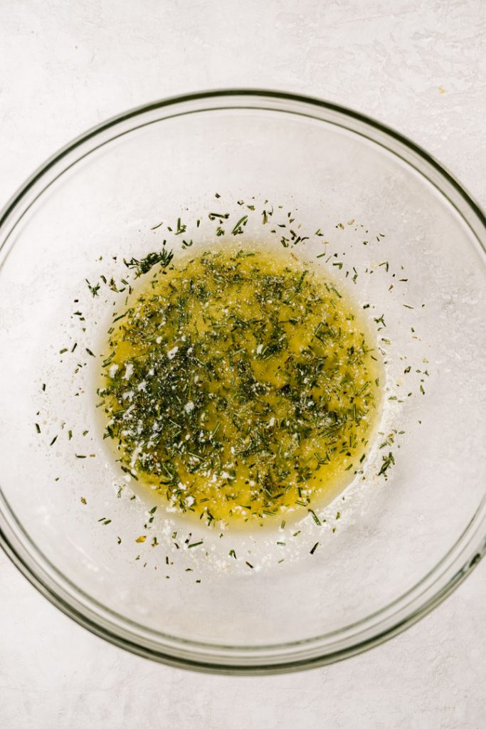 Melted butter whisked with olive oil and fresh herbs.