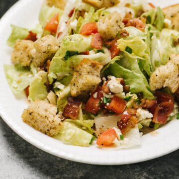 A white bowl with chopped wedge salad.