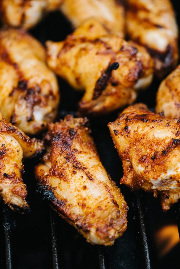 Grilled wings that are slightly blackened on the edges. 