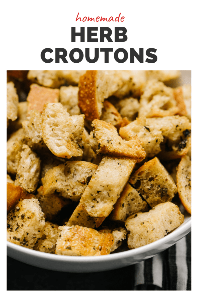 Bowl of homemade croutons with a top banner that reads homemade herb croutons.