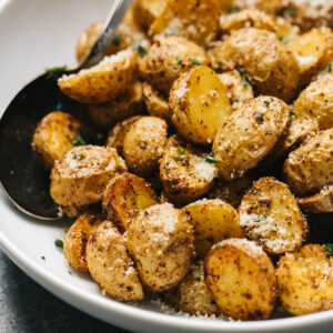Air fryer roasted potatoes in a bowl.