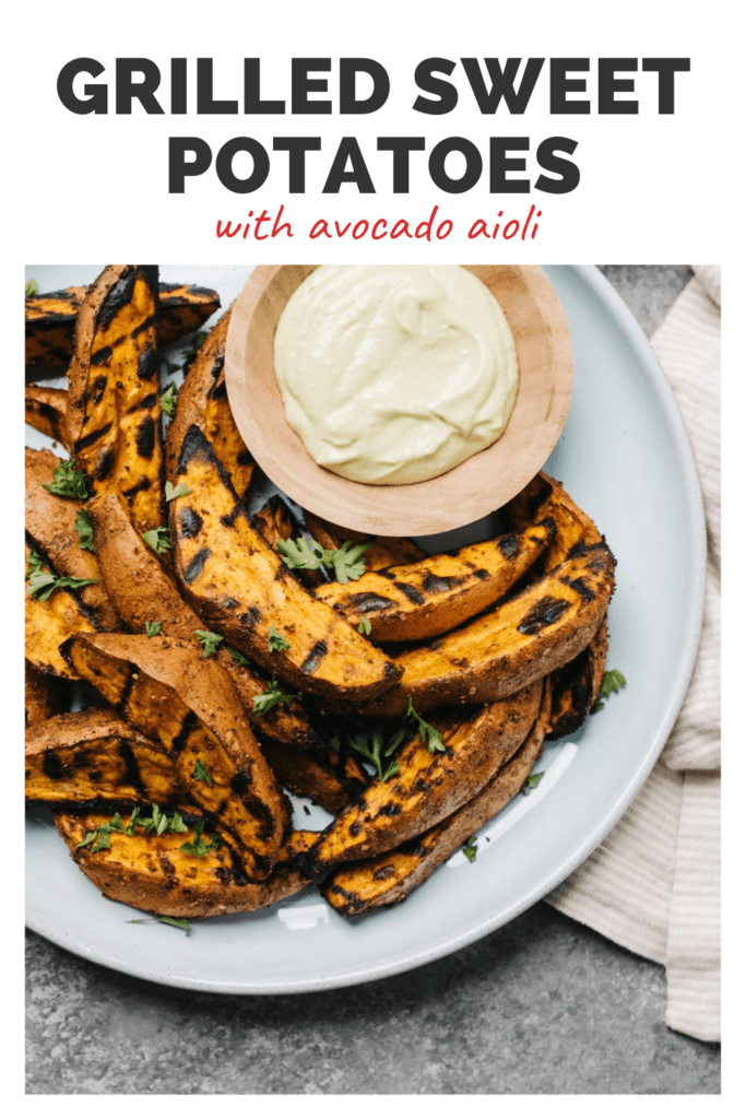A plate of grilled sweet potato wedges and a side of aioli with a top banner that reads grilled sweet potatoes with avocado aioli.