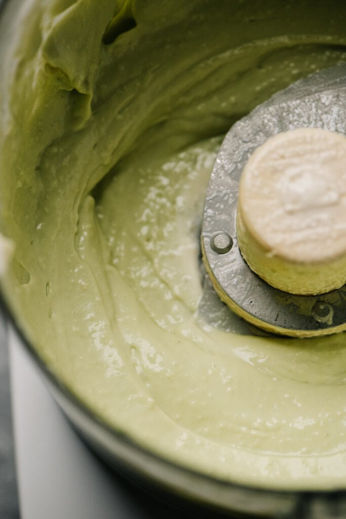 Avocado aioli sauce blended in a food processor. 