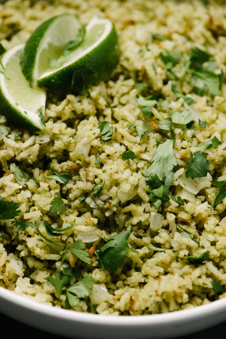 Close up of fluffy Mexican green rice with lime 