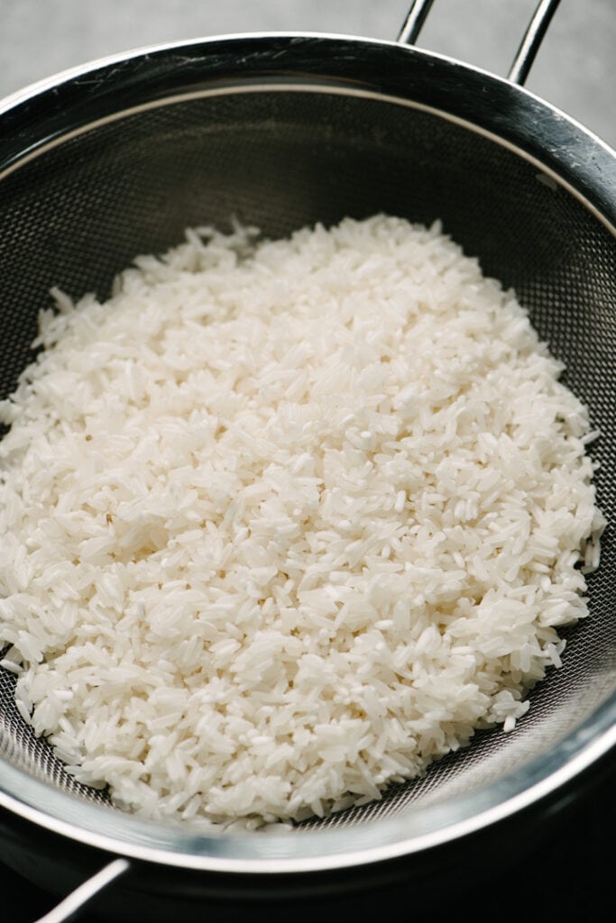 Rice in a colander. 