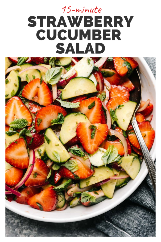 Strawberry cucumber salad in a white bowl with a top banner that reads 15 minutes strawberry cucumber salad.