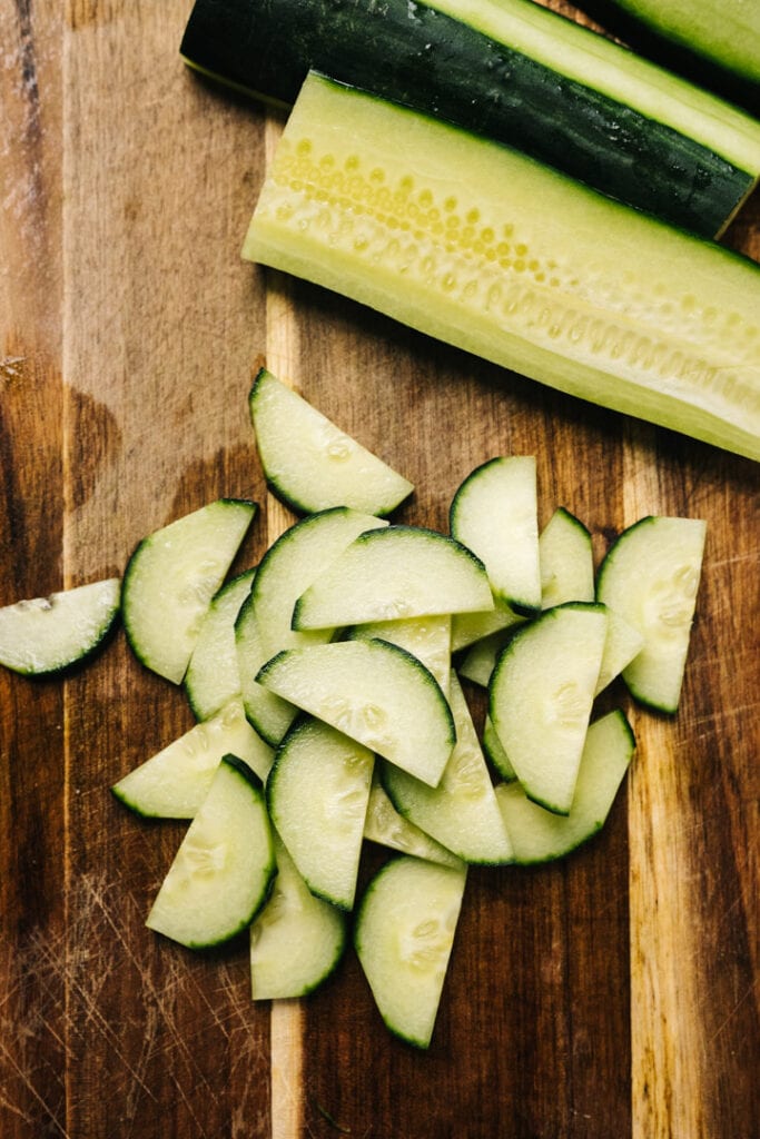 Sliced cucumber on a cutting board. 