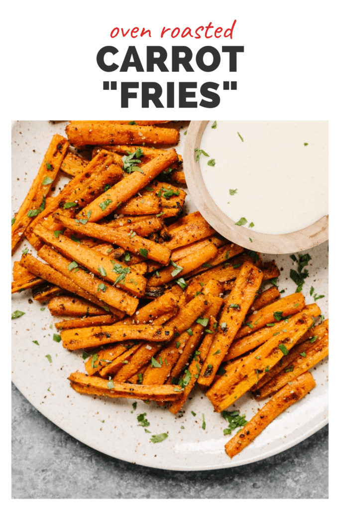 Roasted carrot fries on a plate with dipping sauce with a top banner that reads oven roasted carrot "fries"..