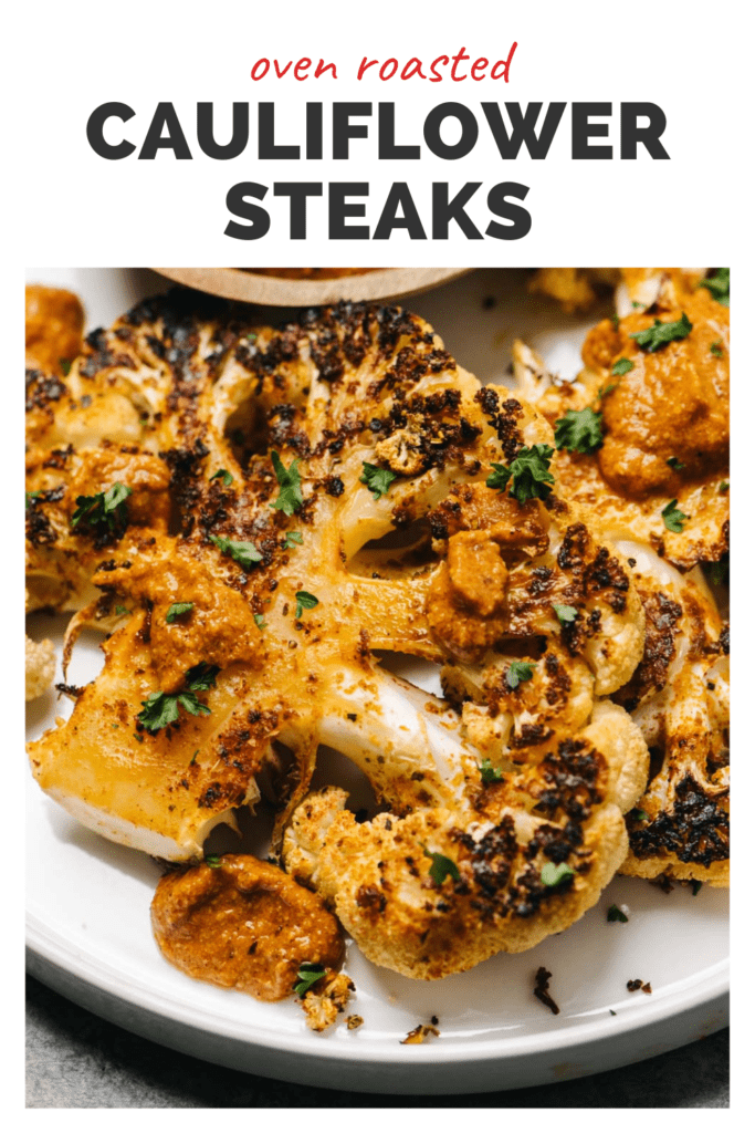 Plate of roasted cauliflower steaks with a top banner that reads oven roasted cauliflower steaks.
