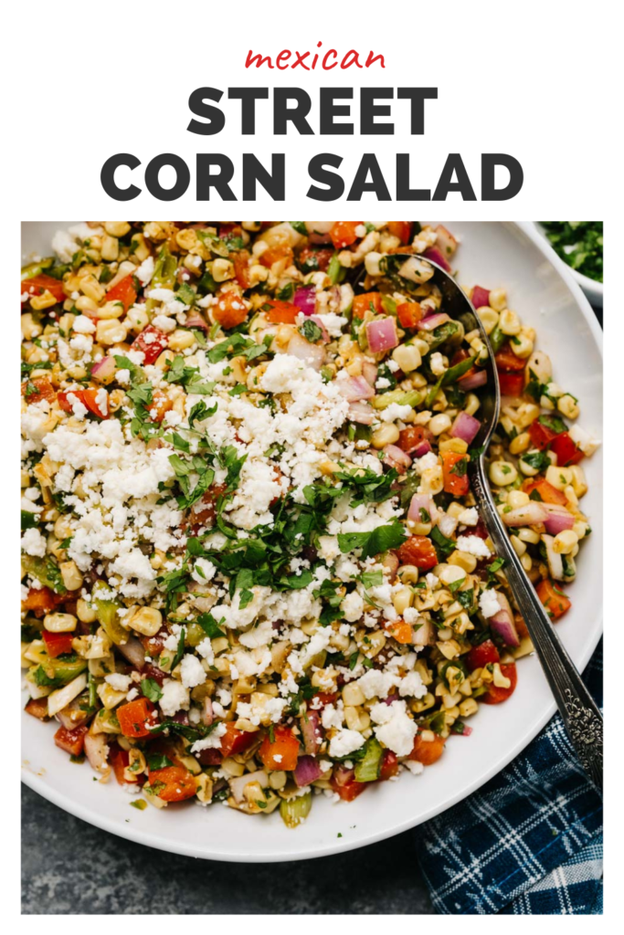 A white bowl of Mexican street corn salad.