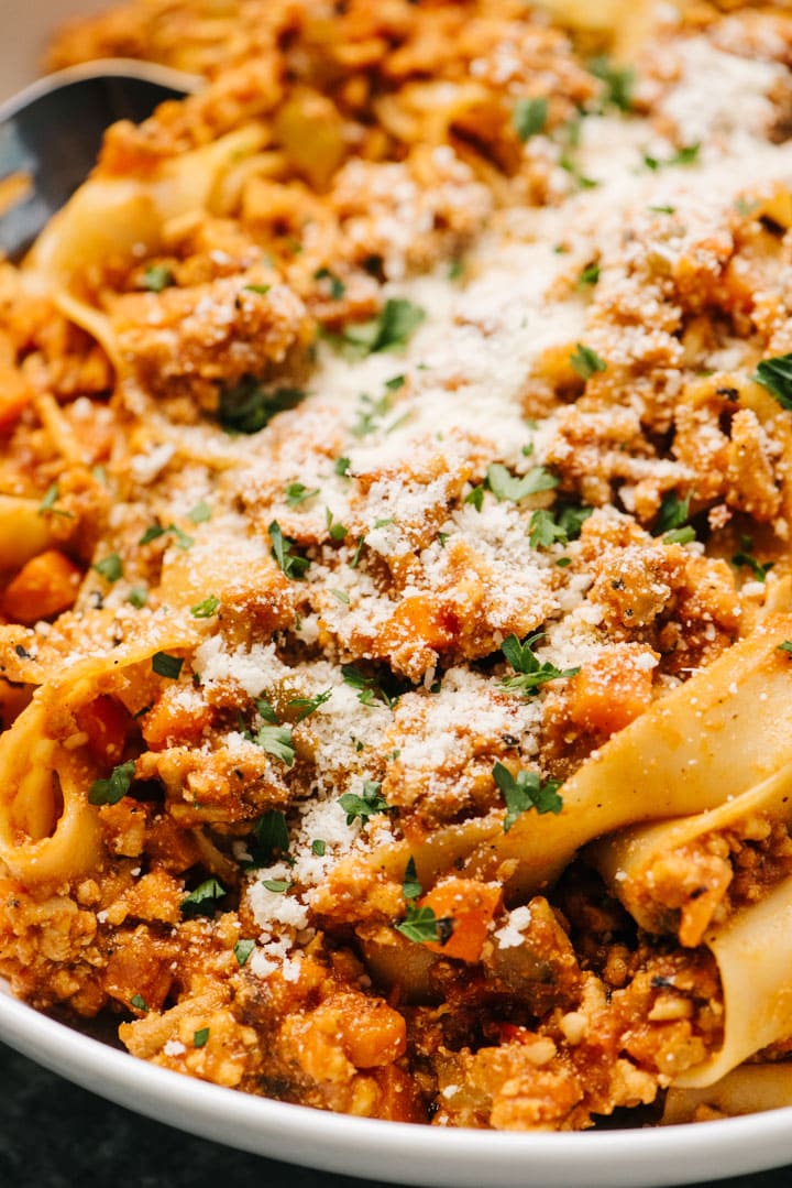 A close up of chicken bolognese pasta. 
