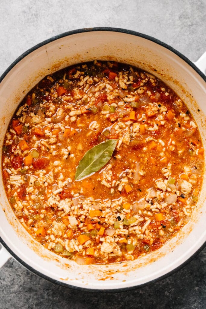 Red bolognese sauce simmering in a pan. 