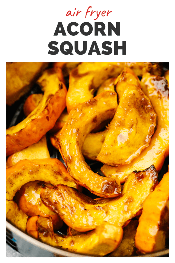 Air fried acorn squash slices on a plate with a top banner that reads air fried acorn squash.
