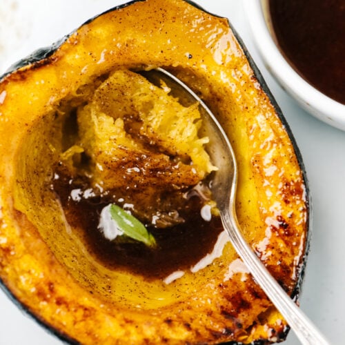 Roasted acorn squash drizzled with maple browned butter and fresh sage.