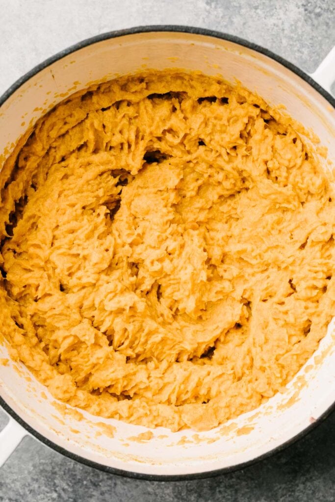 A bowl of mashed sweet potatoes. 