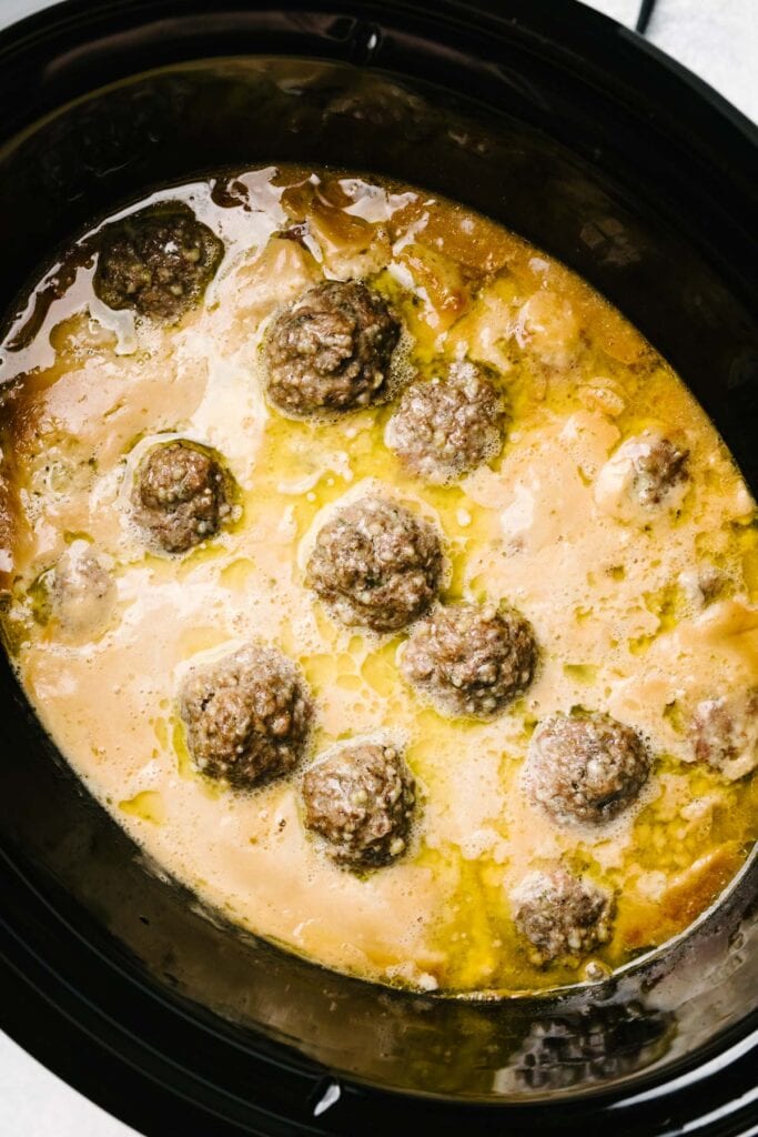 Cooked Swedish meatballs in a crockpot.