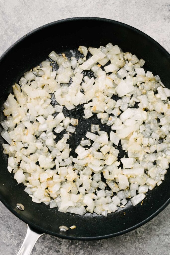 Sautéed onions and garlic in a skillet.