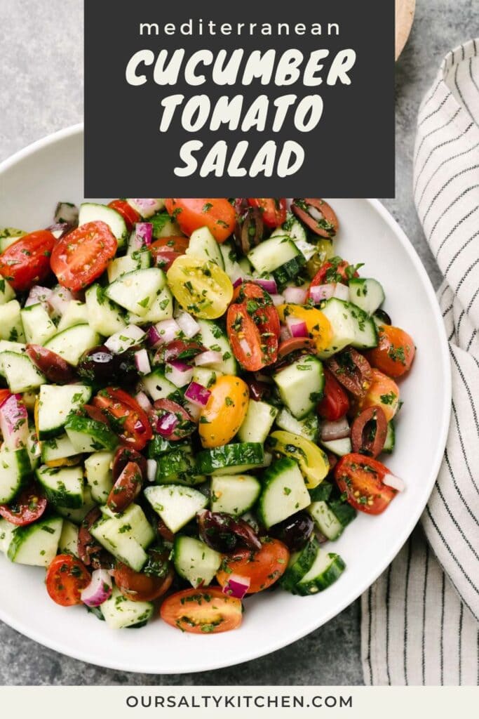 Mediterranean cucumber salad in a large white serving bowl on a concrete background with a striped linen napkin and small wood bowl filled with salt and pepper for seasoning; title bar at the top reads "mediterranean cucumber tomato salad".