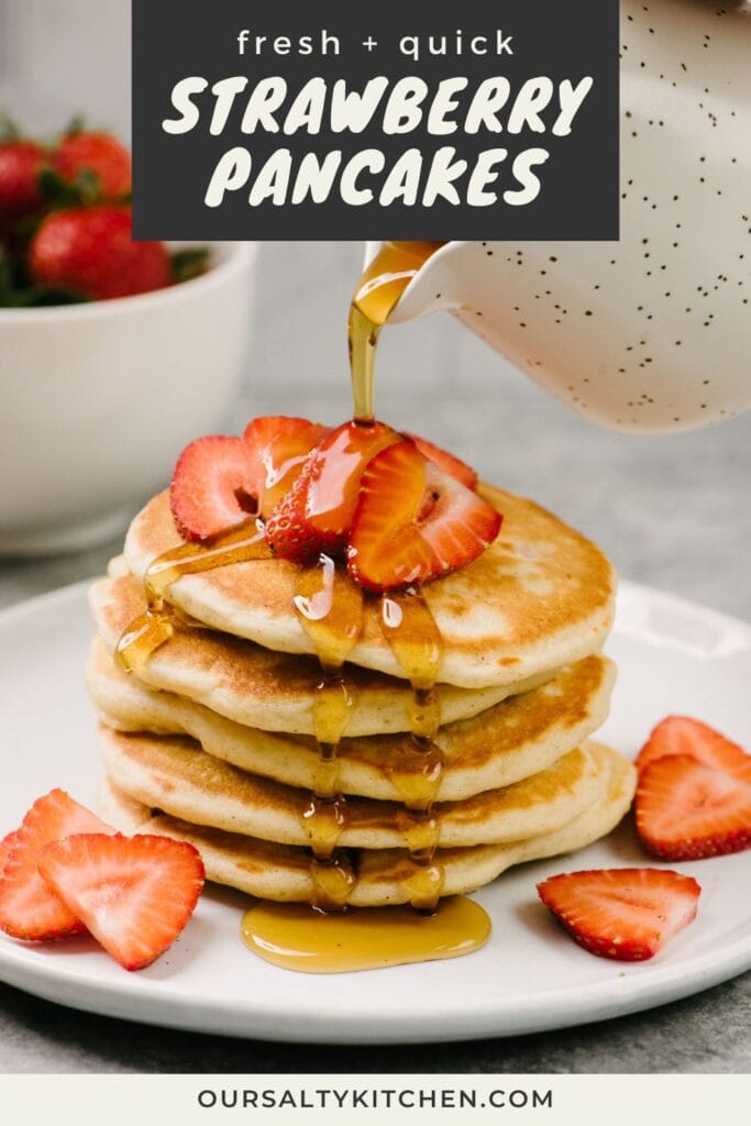 Side view, pouring maple syrup over a stack of strawberry pancakes, topped with more fresh sliced strawberries; a bowl of fresh strawberries are in the background; title bar at the top reads "fresh and quick strawberry pancakes".