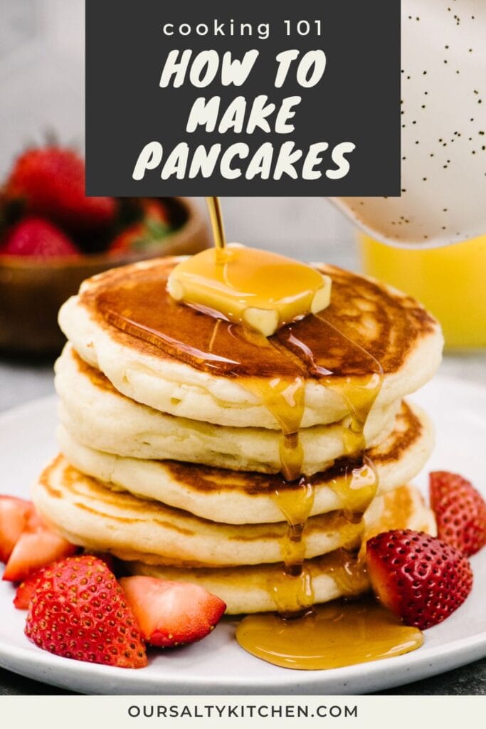 Side view, pouring maple syrup from a small speckled pitcher over a stack of fluffy homemade pancakes topped with butter and plated with fresh strawberries; title bar at the top reads "cooking 101 - how to make pancakes".