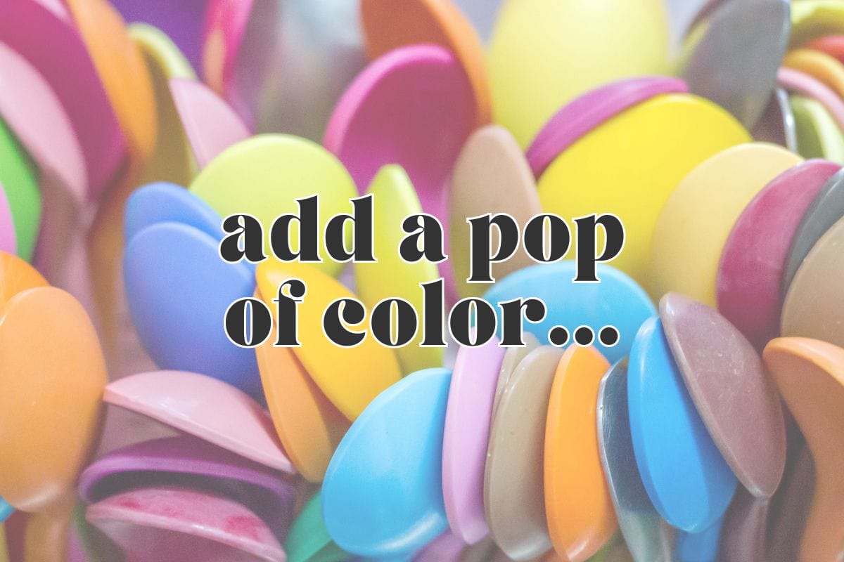 Side view, tightly packed colorful spoons; text overlay reads "add a pop of color...".