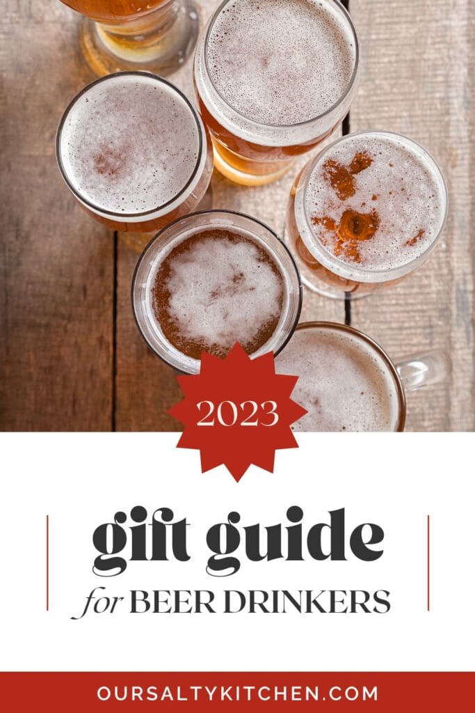 Overhead view - various shaped beer glasses filled with beer on a concrete background; text box at the bottom reads "2023 gift guide for beer drinkers".