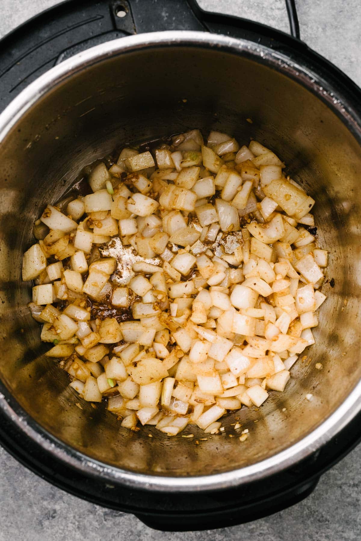 Sautéed onions and garlic in an Instant Pot.